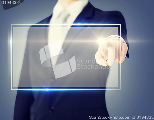 Image of male hand touching virtual screen