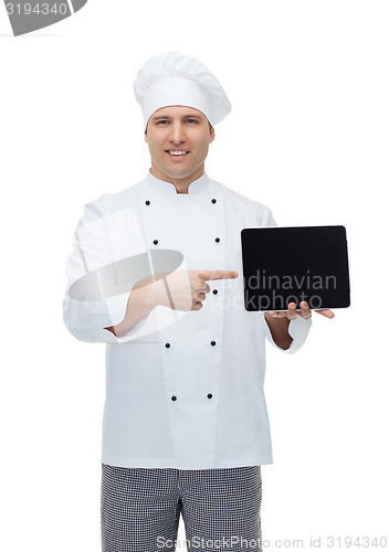 Image of happy male chef cook showing with tablet pc