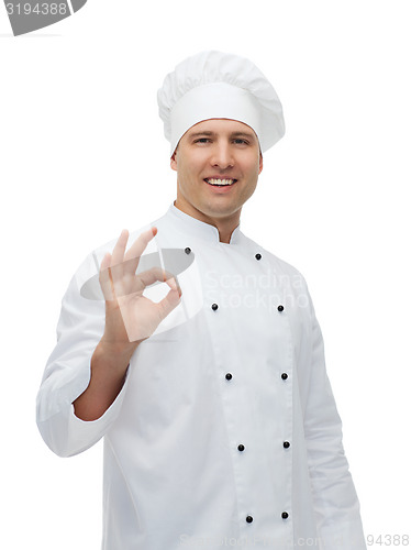 Image of happy male chef cook showing ok sign