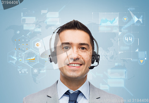 Image of smiling businessman in headset