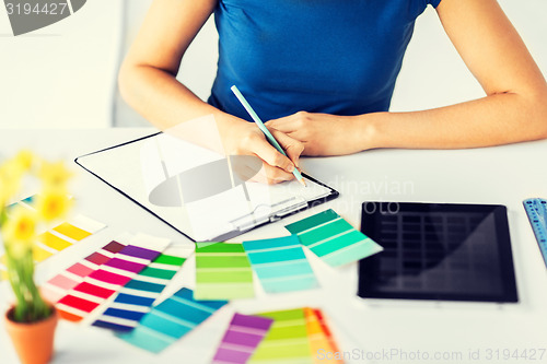 Image of woman working with color samples for selection