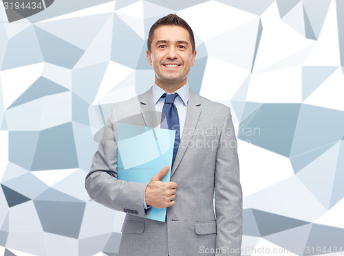 Image of happy businessman holding folder