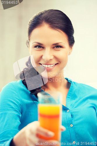 Image of beautiful woman with glass of juice