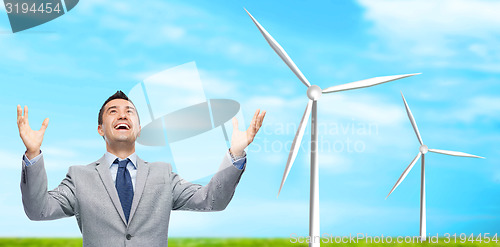 Image of happy laughing businessman in suit