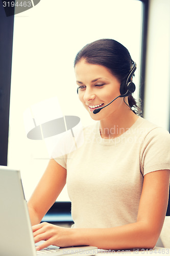 Image of helpline operator with laptop computer