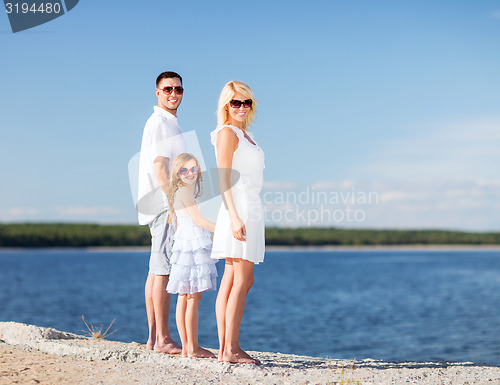 Image of happy family with blue sky