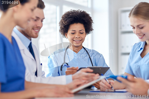 Image of group of happy doctors meeting at hospital office