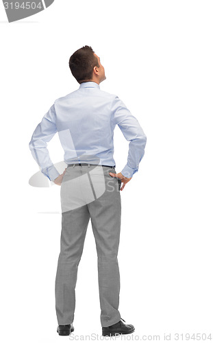 Image of businessman looking up from back