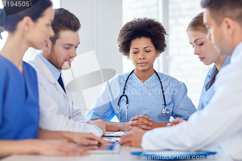 Image of group of happy doctors meeting at hospital office