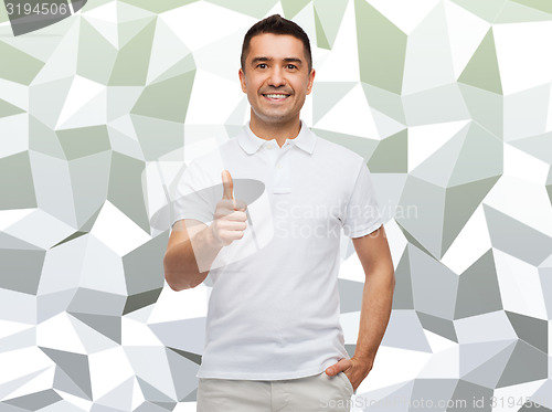 Image of smiling man showing thumbs up