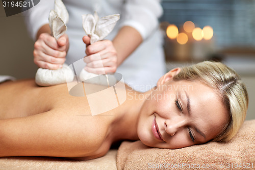 Image of close up of woman lying on massage table in spa