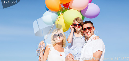 Image of family with colorful balloons