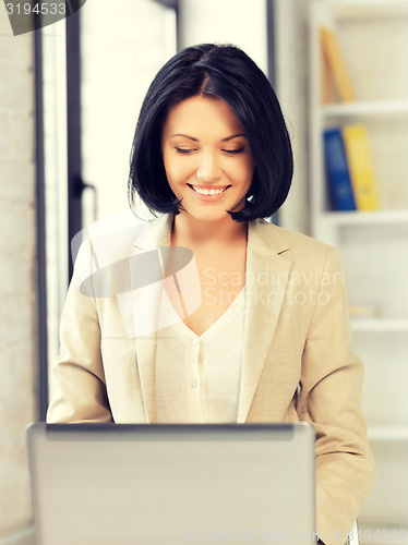 Image of happy woman with laptop computer