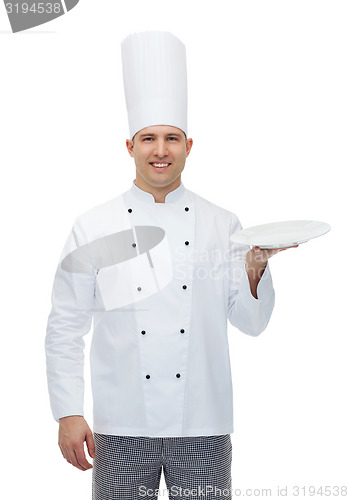 Image of happy male chef cook showing empty plate