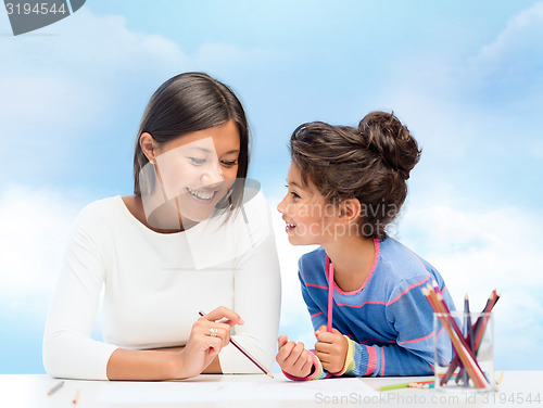 Image of mother and daughter drawing