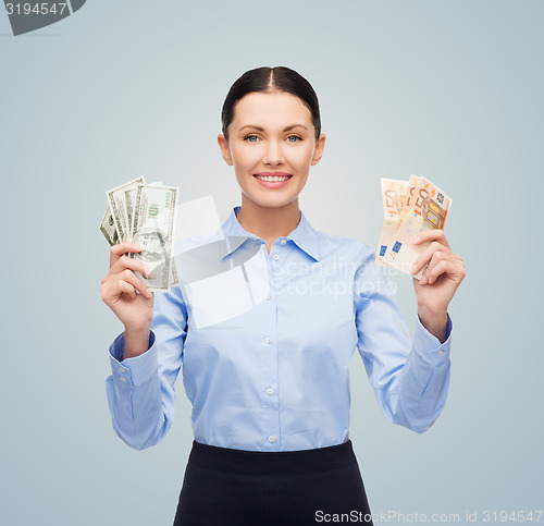 Image of businesswoman with dollar and euro cash money