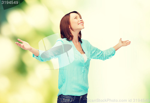 Image of smiling woman waving hands