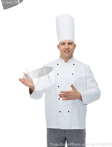 Image of happy male chef cook inviting