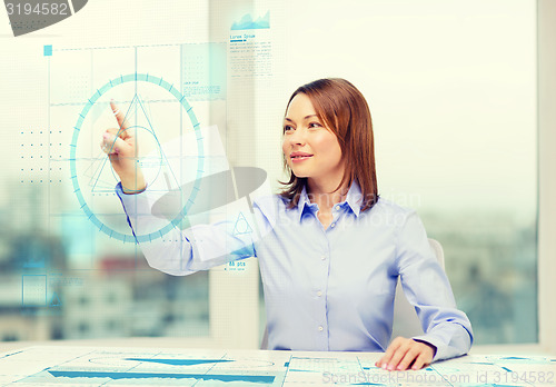 Image of smiling businesswoman working with virtual screen