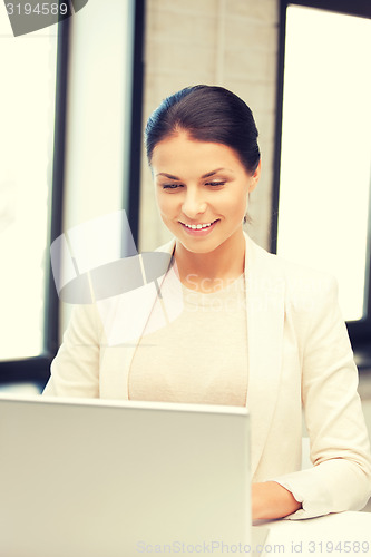 Image of happy woman with laptop computer