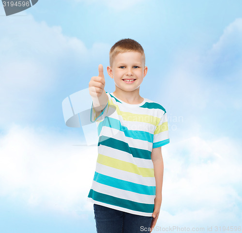 Image of little boy in casual clothes with arms crossed