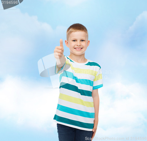 Image of little boy in casual clothes with arms crossed