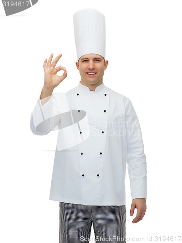 Image of happy male chef cook showing ok sign