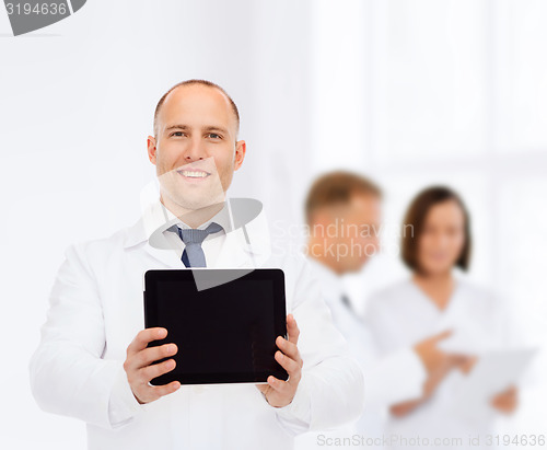 Image of smiling male doctor with tablet pc