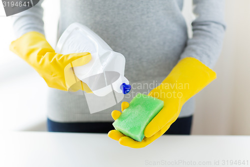 Image of close up of woman with sponge and cleanser