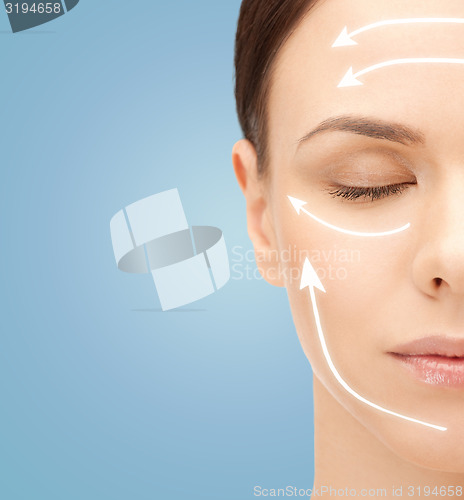 Image of beautiful young woman face with facelift marks