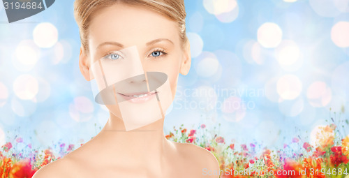 Image of beautiful young woman face over blue background