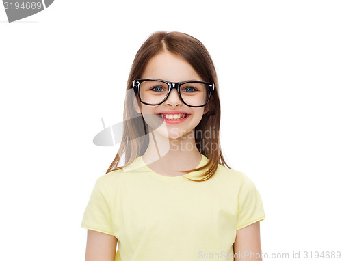 Image of smiling cute little girl in black eyeglasses