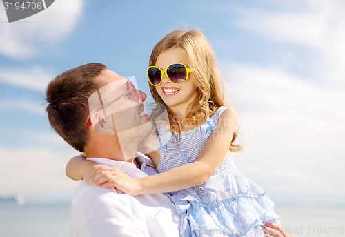 Image of happy father and child girl having fun outdoors