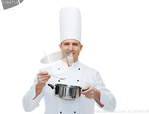 Image of happy male chef cook with pot and spoon