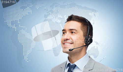 Image of smiling businessman in headset