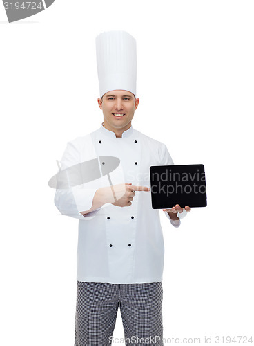 Image of happy male chef cook showing with tablet pc