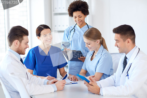 Image of group of happy doctors meeting at hospital office