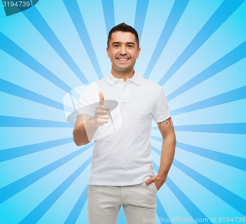 Image of smiling man showing thumbs up