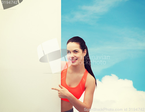 Image of teenage girl in sportswear with white board
