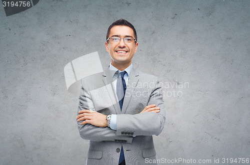 Image of happy smiling businessman in eyeglasses and suit