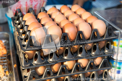 Image of fresh eggs on tray at asian street market