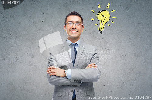 Image of happy smiling businessman in eyeglasses and suit