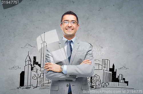 Image of happy smiling businessman in eyeglasses and suit