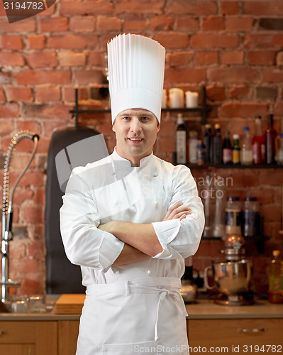 Image of happy male chef cook in restaurant kitchen