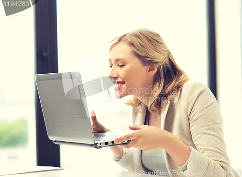 Image of happy woman with laptop computer