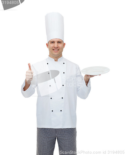 Image of happy male chef cook showing thumbs up and plate