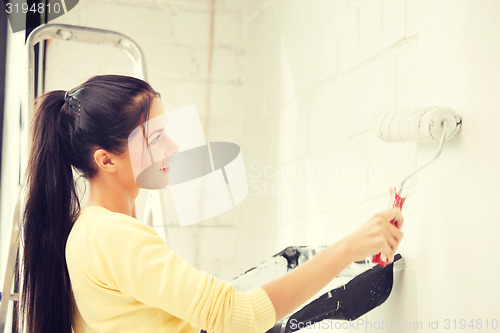 Image of lovely housewife painting