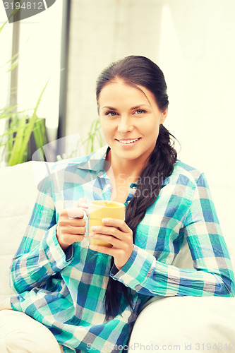 Image of lovely housewife with mug