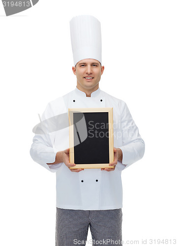 Image of happy male chef cook holding blank menu board
