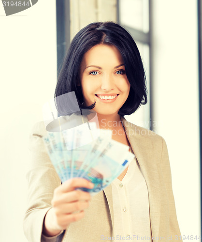 Image of lovely woman with euro cash money